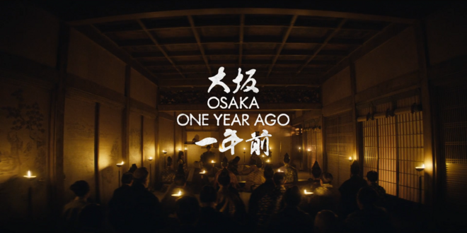 IMAGE: Still - Still from Season 1 Episode two with the text "Osaka, One Year Ago"
