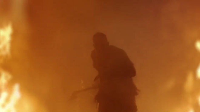 IMAGE: Still - figure walking through fire from season 4 sequence