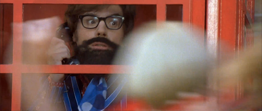 IMAGE: Still of Austin Powers hiding in a phone booth